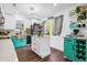 Bright, modern kitchen with white and teal cabinets, stainless steel sink and modern appliances at 1554 Cardinal Rd, Jonesboro, GA 30238