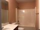Bathroom featuring a tub with shower, toilet, and a sink with vanity at 1938 Dilcrest Dr, Duluth, GA 30096