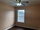 Bright bedroom featuring a ceiling fan, natural light from the window and a hardwood floor at 1938 Dilcrest Dr, Duluth, GA 30096
