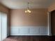 Dining area with chair rail, wood flooring, and large window for natural light, ready for gatherings at 1938 Dilcrest Dr, Duluth, GA 30096