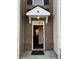 Inviting front door with brick accents and a covered entryway that leads into a bright home at 1938 Dilcrest Dr, Duluth, GA 30096