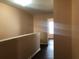 Hallway with wood floors and neutral colored walls at 1938 Dilcrest Dr, Duluth, GA 30096