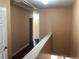 Hallway upstairs with wood-look floors, neutral walls and white doors leading to the bedrooms at 1938 Dilcrest Dr, Duluth, GA 30096
