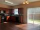 Kitchen featuring dark wood cabinets and access to an outdoor patio through sliding glass doors at 1938 Dilcrest Dr, Duluth, GA 30096