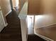 Staircase with wooden steps and white banister with a hallway at 1938 Dilcrest Dr, Duluth, GA 30096