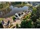Aerial view of a residential community featuring a lake with luxurious homes and manicured lawns at 2201 Old Dallas Sw Rd, Marietta, GA 30064