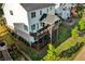 Multi-level back decks offer ample space for outdoor living, overlooking a beautifully landscaped yard and waterfront at 2201 Old Dallas Sw Rd, Marietta, GA 30064