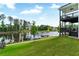 The lush green backyard and tranquil pond offer stunning views from the home's multi-level deck at 2201 Old Dallas Sw Rd, Marietta, GA 30064