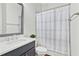 Bathroom offers a shower with a gray curtain, as well as a sink and vanity at 2201 Old Dallas Sw Rd, Marietta, GA 30064