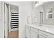 Clean bathroom with quartz countertop, cabinets, and a shower with black and white curtains at 2201 Old Dallas Sw Rd, Marietta, GA 30064