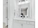 Bright bathroom with white cabinets, quartz countertop, and a framed mirror at 2201 Old Dallas Sw Rd, Marietta, GA 30064