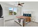 Comfortable bedroom with a ceiling fan, bright window views, and natural light at 2201 Old Dallas Sw Rd, Marietta, GA 30064