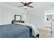 Well-lit bedroom with neutral walls, plush carpet, and a ceiling fan at 2201 Old Dallas Sw Rd, Marietta, GA 30064