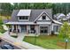 Exterior of community clubhouse with rocking chairs on the covered porch and green lawn at 2201 Old Dallas Sw Rd, Marietta, GA 30064