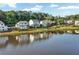 Scenic view of community homes along the lake with mature trees and manicured lawns at 2201 Old Dallas Sw Rd, Marietta, GA 30064