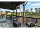 A relaxing deck with wicker furniture provides stunning waterfront views, creating an inviting outdoor space at 2201 Old Dallas Sw Rd, Marietta, GA 30064