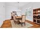 Dining room features hardwood floors, a modern chandelier, and an area rug at 2201 Old Dallas Sw Rd, Marietta, GA 30064
