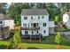 Exterior view showcasing the home's multi-level back decks and serene yard, perfect for relaxing and enjoying outdoors at 2201 Old Dallas Sw Rd, Marietta, GA 30064