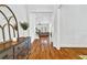 Welcoming foyer with hardwood floors, elegant decor, and a view into the living room at 2201 Old Dallas Sw Rd, Marietta, GA 30064