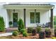 Inviting front porch with seating, landscaping, and stylish exterior lighting at 2201 Old Dallas Sw Rd, Marietta, GA 30064