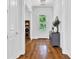 Bright hallway with hardwood floors, elegant trim, and a glimpse of the front door at 2201 Old Dallas Sw Rd, Marietta, GA 30064