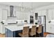 Modern kitchen with stainless steel appliances, white cabinets, and an island with bar seating at 2201 Old Dallas Sw Rd, Marietta, GA 30064