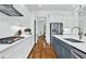 Kitchen with stainless appliances, white cabinetry, and center island at 2201 Old Dallas Sw Rd, Marietta, GA 30064