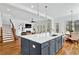 Kitchen island with sink and view to living area at 2201 Old Dallas Sw Rd, Marietta, GA 30064