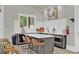 Modern kitchenette with white countertops, barstool seating, and a beverage cooler at 2201 Old Dallas Sw Rd, Marietta, GA 30064