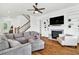 Bright living room with hardwood floors, fireplace, and staircase at 2201 Old Dallas Sw Rd, Marietta, GA 30064