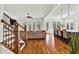 Open-concept living room with hardwood floors, lots of windows, and stylish staircase at 2201 Old Dallas Sw Rd, Marietta, GA 30064