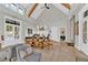 Bright lounge space with a dining table and chairs, neutral color palette, and wood floors at 2201 Old Dallas Sw Rd, Marietta, GA 30064
