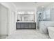 Elegant main bathroom with marble floors, a large soaking tub, and a glass shower enclosure at 2201 Old Dallas Sw Rd, Marietta, GA 30064