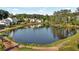 Beautiful lake view with green space and single Gathering homes in the distance at 2201 Old Dallas Sw Rd, Marietta, GA 30064