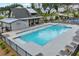 Community pool with lounge chairs, steel handrails, and an adjacent clubhouse with homes nearby at 2201 Old Dallas Sw Rd, Marietta, GA 30064