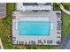 Aerial view of a community pool, with lounge chairs and a fenced perimeter at 2201 Old Dallas Sw Rd, Marietta, GA 30064