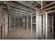 Awaiting completion basement with exposed beams and structural elements, great potential for customization at 2952 Mcafee Rd, Decatur, GA 30032