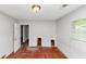 Bedroom featuring a window for natural light and hardwood floors at 2952 Mcafee Rd, Decatur, GA 30032