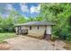Cozy one-level home boasts a timeless appeal and a neatly maintained front yard at 2952 Mcafee Rd, Decatur, GA 30032