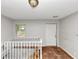 Interior view of hallway with white railing and natural light filtering through the window at 2952 Mcafee Rd, Decatur, GA 30032