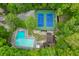 Aerial view of the community pool and tennis courts surrounded by lush greenery at 3460 Wycherly Ne Ct, Brookhaven, GA 30319