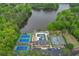 Aerial view showcases a community pool, tennis courts, clubhouse, and lake at 3460 Wycherly Ne Ct, Brookhaven, GA 30319