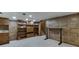 Finished basement with wood-paneled walls, built-in shelving, carpeted floor, and recessed lighting at 3460 Wycherly Ne Ct, Brookhaven, GA 30319