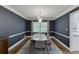 Dining room boasts modern lighting, large windows, and space for Gathering gatherings at 3460 Wycherly Ne Ct, Brookhaven, GA 30319
