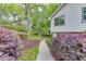 Charming two-story home with a light blue door and beautifully landscaped front yard surrounded by lush green trees at 3460 Wycherly Ne Ct, Brookhaven, GA 30319
