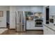 Kitchen features stainless steel appliances including refrigerator, oven and microwave, plus white cabinets at 3460 Wycherly Ne Ct, Brookhaven, GA 30319