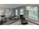 Bright living room featuring sleek furniture, a modern rug, and plenty of natural light at 3460 Wycherly Ne Ct, Brookhaven, GA 30319