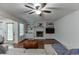 Cozy living room boasts a brick fireplace, built-in shelving and hardwood floors at 3460 Wycherly Ne Ct, Brookhaven, GA 30319