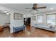 Comfortable living room featuring hardwood floors, neutral walls, ceiling fan and a cozy seating area at 3460 Wycherly Ne Ct, Brookhaven, GA 30319
