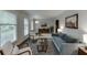 Bright living room with floor to ceiling windows, neutral walls and modern decor at 3460 Wycherly Ne Ct, Brookhaven, GA 30319